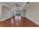Bright living room with hardwood floors, recessed lighting, and access to a screened balcony at 1349 Aqui Esta Dr # 121, Punta Gorda, FL 33950