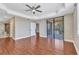 Large main bedroom with tray ceilings, sliding glass doors, and ensuite bathroom access at 1349 Aqui Esta Dr # 121, Punta Gorda, FL 33950