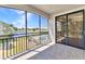 A screened patio overlooks a canal, community pool and landscaping at 1349 Aqui Esta Dr # 121, Punta Gorda, FL 33950