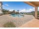 Community pool with waterway views and a jacuzzi on a brick paver deck at 1349 Aqui Esta Dr # 121, Punta Gorda, FL 33950