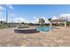 Community pool and hot tub on brick deck with gazebo and waterway views at 1349 Aqui Esta Dr # 121, Punta Gorda, FL 33950