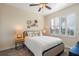 Serene bedroom featuring a large window with plantation shutters and stylish decor at 14142 Fort Myers Ave, Port Charlotte, FL 33981