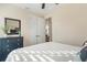 Comfortable bedroom featuring a dresser, mirror, and a bright, inviting space at 14142 Fort Myers Ave, Port Charlotte, FL 33981