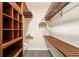 Walk-in closet featuring custom wood shelving and ample storage space for clothing at 14142 Fort Myers Ave, Port Charlotte, FL 33981