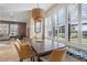 Dining area featuring abundant light from bright windows, neutral tones, and comfortable seating at 14142 Fort Myers Ave, Port Charlotte, FL 33981