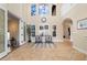 Bright foyer with tile floors, large windows, and seating area provides a welcoming entrance at 14142 Fort Myers Ave, Port Charlotte, FL 33981