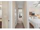 Hallway view leading to bedrooms and bathroom, showcasing the home's layout at 14142 Fort Myers Ave, Port Charlotte, FL 33981