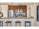 Open kitchen featuring granite counters, stainless steel appliances, and breakfast bar seating at 14142 Fort Myers Ave, Port Charlotte, FL 33981