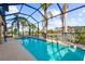 An enclosed pool area features a beautiful pool and spa, perfect for relaxation at 14142 Fort Myers Ave, Port Charlotte, FL 33981