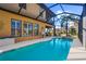 The beautiful pool area features a basketball hoop and plenty of room to relax at 14142 Fort Myers Ave, Port Charlotte, FL 33981