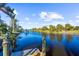 This waterfront property offers a dock and stunning views of the canal and the surrounding neighborhood at 14142 Fort Myers Ave, Port Charlotte, FL 33981