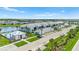 Gorgeous aerial view of condo buildings, garages, pool, and beautiful landscaping at 14224 Heritage Landing Blvd # 923, Punta Gorda, FL 33955