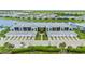 Aerial view of condos with garages, landscaping, and beautiful water views at 14224 Heritage Landing Blvd # 923, Punta Gorda, FL 33955