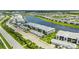 Stunning aerial view of condos with beautiful landscaping and water views at 14224 Heritage Landing Blvd # 923, Punta Gorda, FL 33955