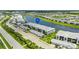 Stunning aerial view of condos with beautiful landscaping and water views at 14224 Heritage Landing Blvd # 923, Punta Gorda, FL 33955
