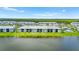 Stunning aerial view of condos with beautiful landscaping and water views at 14224 Heritage Landing Blvd # 923, Punta Gorda, FL 33955