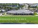 Aerial view of community clubhouse, golf course and pond at 14224 Heritage Landing Blvd # 923, Punta Gorda, FL 33955