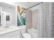 Bathroom featuring a vanity, toilet, bathtub, shower with artistic decor at 14224 Heritage Landing Blvd # 923, Punta Gorda, FL 33955