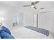 Bright bedroom with a ceiling fan, a window, and double door closets at 14224 Heritage Landing Blvd # 923, Punta Gorda, FL 33955
