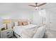 Bright bedroom with a ceiling fan and a view into the ensuite bathroom at 14224 Heritage Landing Blvd # 923, Punta Gorda, FL 33955