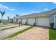 Attached garages featuring paved driveways and manicured landscaping enhance curb appeal at 14224 Heritage Landing Blvd # 923, Punta Gorda, FL 33955