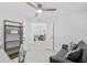 Bright home office featuring a sofa, desk, and shelving, with an open doorway leading into the adjacent living area at 14224 Heritage Landing Blvd # 923, Punta Gorda, FL 33955