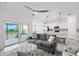 Bright living room and kitchen area featuring a comfortable seating area at 14224 Heritage Landing Blvd # 923, Punta Gorda, FL 33955