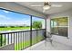 Enjoy the breeze on this screened lanai, offering a ceiling fan and tranquil views over the water at 14224 Heritage Landing Blvd # 923, Punta Gorda, FL 33955