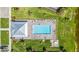 Aerial view of a luxurious pool area with ample seating and a covered pavilion at 14224 Heritage Landing Blvd # 923, Punta Gorda, FL 33955