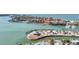 Beautiful aerial view of a waterfront area with a pier, boats, and homes, capturing a scenic landscape at 1701 Beach Rd # 305, Englewood, FL 34223