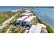 Waterfront condo complex with stunning bay views, featuring well-maintained buildings and lush landscaping at 1701 Beach Rd # 305, Englewood, FL 34223