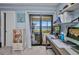 Balcony view of the waterway and the sliding glass doors and a view of the exterior and an office space at 1701 Beach Rd # 305, Englewood, FL 34223