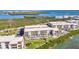 Waterfront condos with a pool and lush landscaping, creating a serene and relaxing atmosphere at 1701 Beach Rd # 305, Englewood, FL 34223