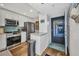 Modern kitchen features stainless steel appliances, white cabinets, and an open design at 1701 Beach Rd # 305, Englewood, FL 34223