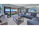 Relaxing living room extends to a balcony with a beautiful water view at 1701 Beach Rd # 305, Englewood, FL 34223