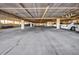 Spacious parking garage offering ample parking spaces for residents, providing covered parking options at 1701 Beach Rd # 305, Englewood, FL 34223