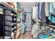 Spacious walk-in closet featuring built-in shelving and ample storage space for clothes, shoes, and accessories at 1701 Beach Rd # 305, Englewood, FL 34223