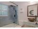 Bathroom featuring custom shower, unique mirror, and designer sink and vanity at 1795 Elinor Pl, Englewood, FL 34223