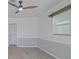 Cozy bedroom features neutral paint, wood-look flooring, and a window for lots of natural light at 1795 Elinor Pl, Englewood, FL 34223