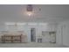 Spacious garage featuring built-in cabinets, a sink, utility hook-ups, and a large workbench area at 1795 Elinor Pl, Englewood, FL 34223