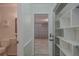 View of hallway and a garage from an adjacent bathroom at 1795 Elinor Pl, Englewood, FL 34223