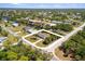 Spacious lot featuring lush landscaping and convenient access to waterfront, canals, and nearby amenities at 18263 Ohara Dr, Port Charlotte, FL 33948