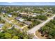 Aerial view of community and neighborhood with water access and mature trees at 18263 Ohara Dr, Port Charlotte, FL 33948