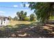 Expansive backyard with lush greenery, mature trees, and partial fencing creates a private outdoor space at 18263 Ohara Dr, Port Charlotte, FL 33948