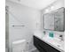 Contemporary bathroom featuring a double sink vanity and modern fixtures, creating a spa-like experience at 18263 Ohara Dr, Port Charlotte, FL 33948