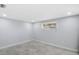 Bedroom with neutral paint, tile floors, and bright window at 18263 Ohara Dr, Port Charlotte, FL 33948