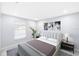 Bright bedroom featuring neutral walls, plush bedding, and stylish artwork at 18263 Ohara Dr, Port Charlotte, FL 33948