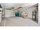 Spacious garage with garage door, water heater, and utility sink at 18263 Ohara Dr, Port Charlotte, FL 33948