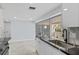 Modern kitchen with granite counters, sleek white cabinetry, and stainless steel appliances for stylish cooking at 18263 Ohara Dr, Port Charlotte, FL 33948