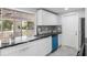 Modern kitchen with granite counters, sleek white cabinetry, and stainless steel appliances for stylish cooking at 18263 Ohara Dr, Port Charlotte, FL 33948